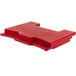 A red plastic Cambro connector with holes.