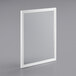 a white rectangular frame on a gray surface