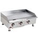 An APW Wyott stainless steel countertop griddle with three burners.