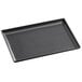 A black rectangular Vollrath tip tray.