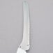 A Dexter-Russell bread and sandwich knife with a white handle.