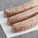 Warrington Farm Meats Sweet Italian Sausage Links on a white surface.