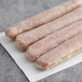 Warrington Farm Meats turkey sausage links on a white surface.