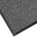 A close-up of a grey Lavex indoor entrance mat with black trim.