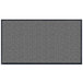 A grey rectangular rug with black border.