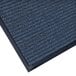 A close-up of a blue Lavex carpet mat with a black border.