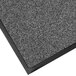A close-up of a gray Lavex carpet entrance mat with black trim.