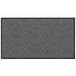 A grey rectangular door mat with a chevron pattern in black.