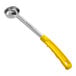 A yellow and silver Choice portion spoon with a handle.