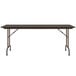 A Correll walnut rectangular folding table with metal legs.