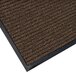 A brown Lavex Needle Rib carpet mat with black trim.