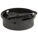 A black plastic circular container with a hole in the center and a screwdriver inside.