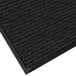 A black carpet mat with a black border and gray details.