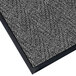 A close up of a gray Lavex carpet mat with black trim.