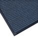 A close-up of a blue Lavex Needle Rib carpet mat with a black border.