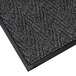 A black and gray Lavex Chevron Rib indoor entrance mat with a black border.