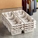a stack of white egg cartons