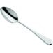 An Amefa stainless steel serving spoon with a silver handle.