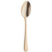 An Amefa stainless steel dessert spoon with a gold handle.