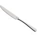 An Amefa stainless steel table knife with a silver handle.
