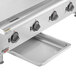 An APW Wyott stainless steel electric countertop griddle on a counter.