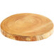 A round wooden serving board with rings on the surface.