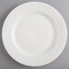 A Homer Laughlin Kensington Ameriwhite bright white china plate with a pattern on it.