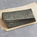A stack of green seaweed sushi nori sheets.