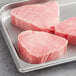 A tray of sushi grade Ahi tuna portions.