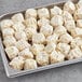 A tray of Passport Cuisine Pork Shumai on a table.