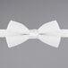 a close-up of a white bow tie