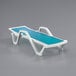 A white Lancaster Table & Seating chaise with a turquoise sling seat.