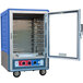 A blue Metro C5 heated holding and proofing cabinet with a clear door open.