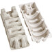 A white paper mache tray with holes.