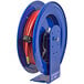 A blue Coxreels air and water hose reel with a red hose attached to it.
