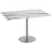 a white marble table with silver legs