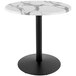 A white marble Holland Bar Stool counter height table with a round black base.