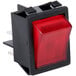 A red switch on a black plastic case.