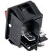 A black electrical switch with a red light and silver metal piece.