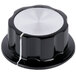 A black knob with white trim.