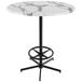 A round white marble Holland Bar Table with a black base.