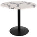 A white marble table with a black base.