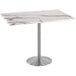 A white marble Holland Bar Table with a silver metal base.