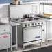 An Imperial Range commercial kitchen with an Imperial Range electric range and pots on the burners.
