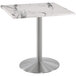 a white marble table with silver metal base