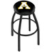 a black round object with a yellow letter