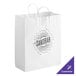 A white paper shopping bag with handles and black customizable text.