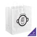 A white paper shopping bag with handles and a logo on it.