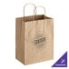 A natural kraft paper shopping bag with handles.