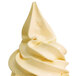 A close up of a white swirl of soft serve made with a Carpigiani Medium Star Nozzle.